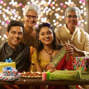 Choosing Your Daughter-in-law; Father, Mother, Son And Daughter-in-law with Festival Lights in the background